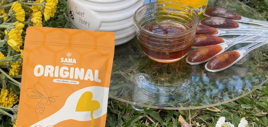 SANA VitaHoney honey spoon showing B vitamins and nutritional value of raw organic honey